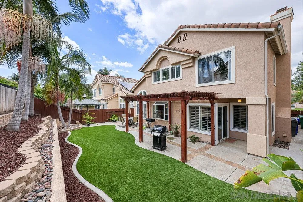 790 Mosaic Circle Oceanside, CA 92057 - Photo 42 of 47 a front view of a house with a yard table and chairs