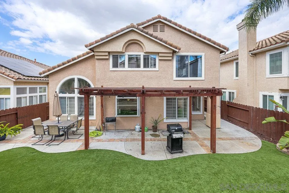 790 Mosaic Circle Oceanside, CA 92057 - Photo 43 of 47 a front view of a house with garden and patio