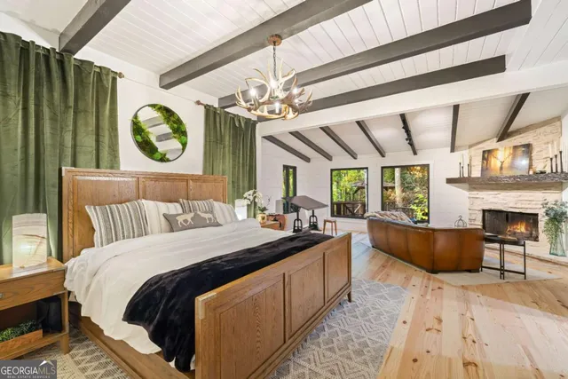 a bedroom with a bed and a television