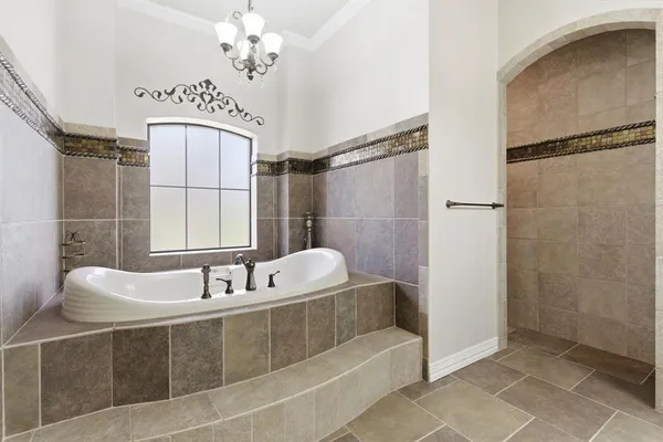 a bathroom with a sink a mirror and a shower