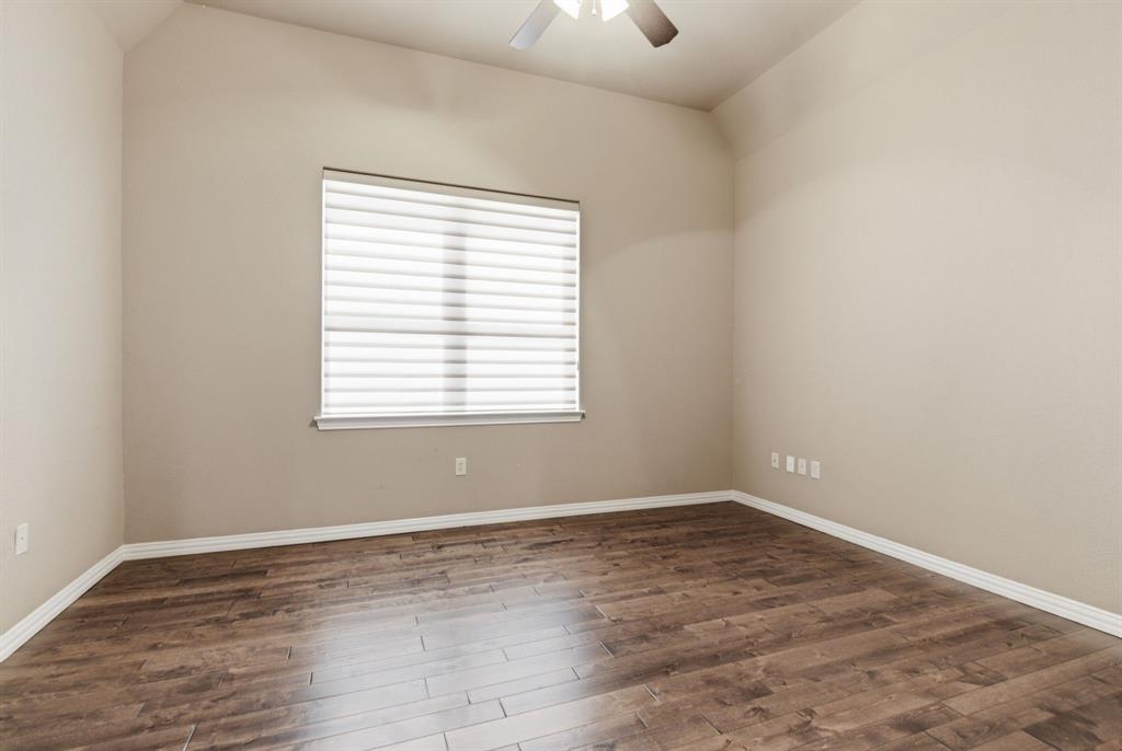 8970 Burnett Road Justin, TX 76247 - Photo 32 of 39 an empty room with wooden floor and windows