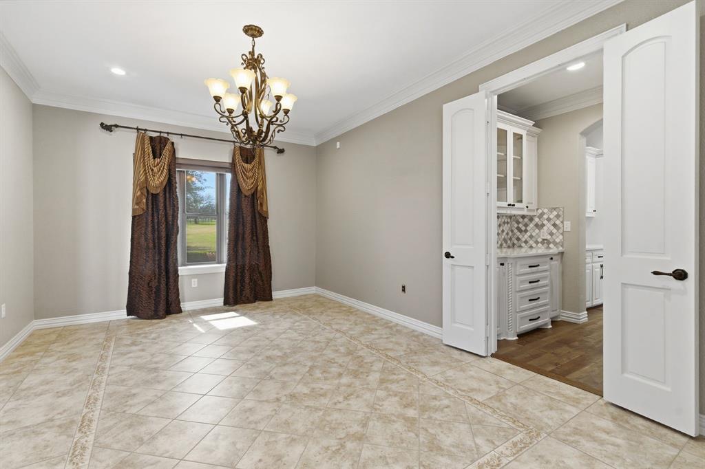8970 Burnett Road Justin, TX 76247 - Photo 6 of 39 a view of a chandelier in big room and chandelier