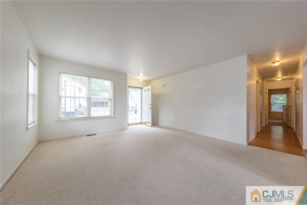 132 Launch Road Manahawkin, NJ 08050 - Photo 2 of 25 a view of an empty room with a window
