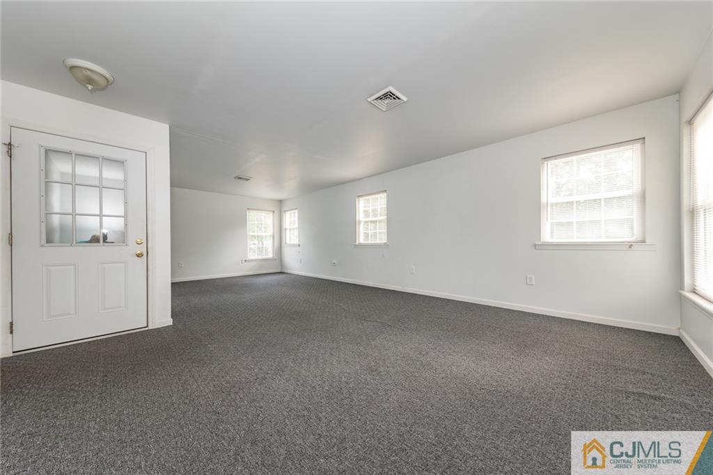 132 Launch Road Manahawkin, NJ 08050 - Photo 14 of 25 an empty room with windows