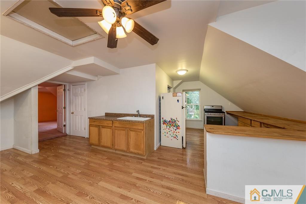 132 Launch Road Manahawkin, NJ 08050 - Photo 16 of 25 a kitchen with stainless steel appliances granite countertop a stove and a refrigerator