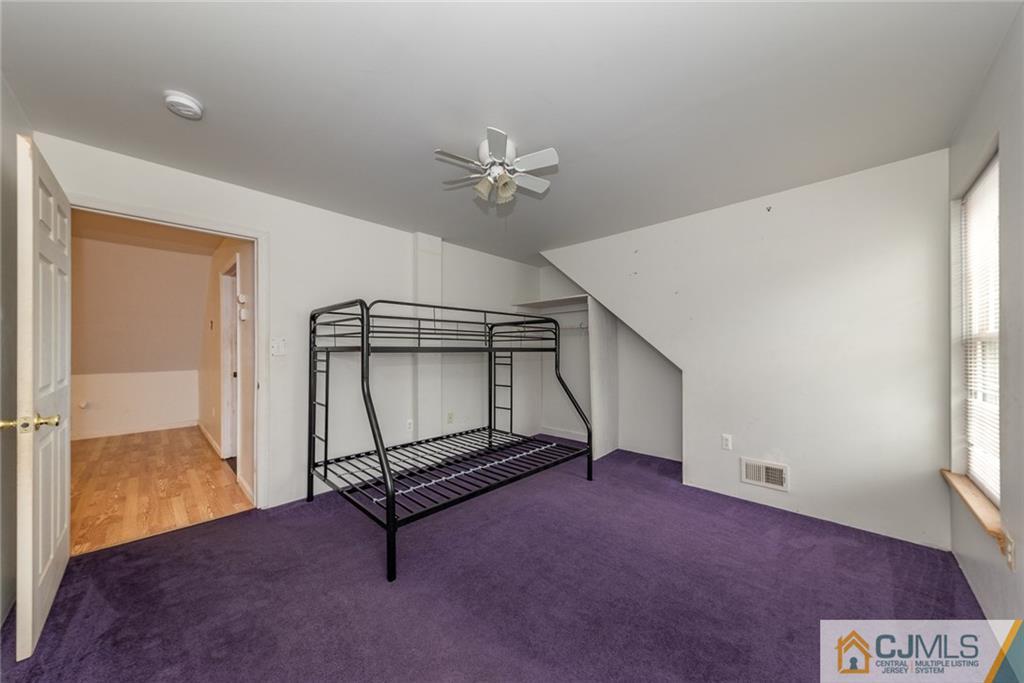 132 Launch Road Manahawkin, NJ 08050 - Photo 20 of 25 a living room with a furniture and a ceiling fan