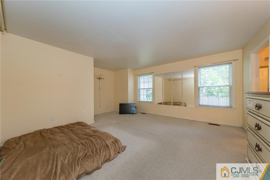 132 Launch Road Manahawkin, NJ 08050 - Photo 10 of 25 a view of an empty room and window