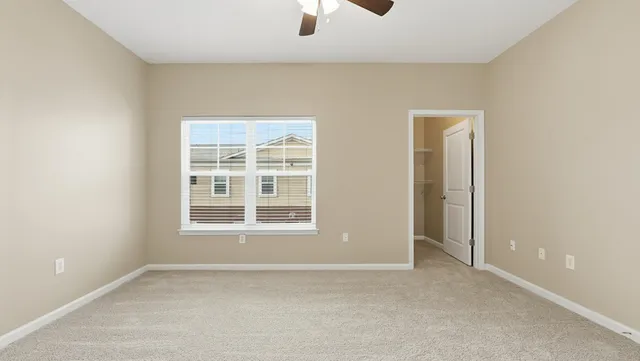 an empty room with a empty space and windows