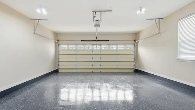 a view of a room with window and a ceiling fan