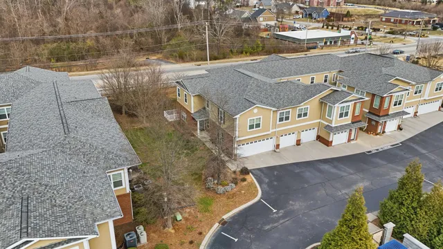an aerial view of a house with a lake view