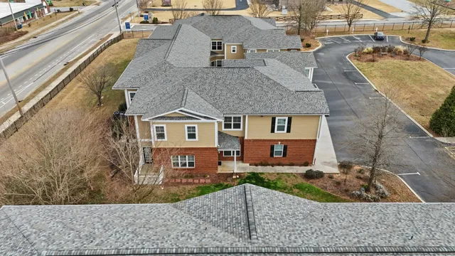 a aerial view of a house with a yard