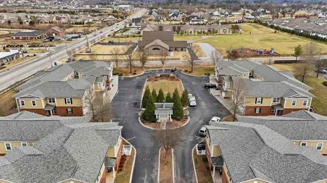 an aerial view of a house with outdoor space