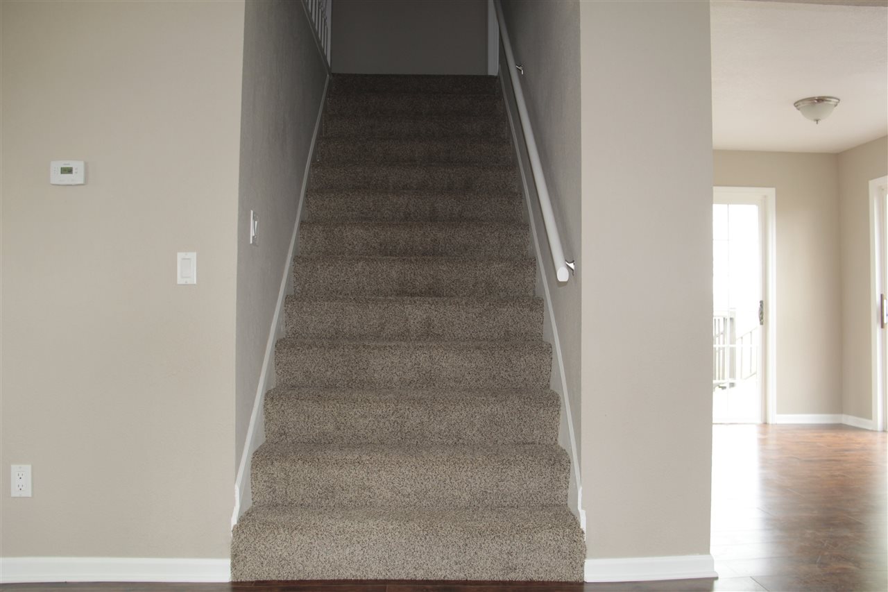 3618 Rotary Road Rockford, IL 61109 - Photo 12 of 24 a view of staircase with white walls