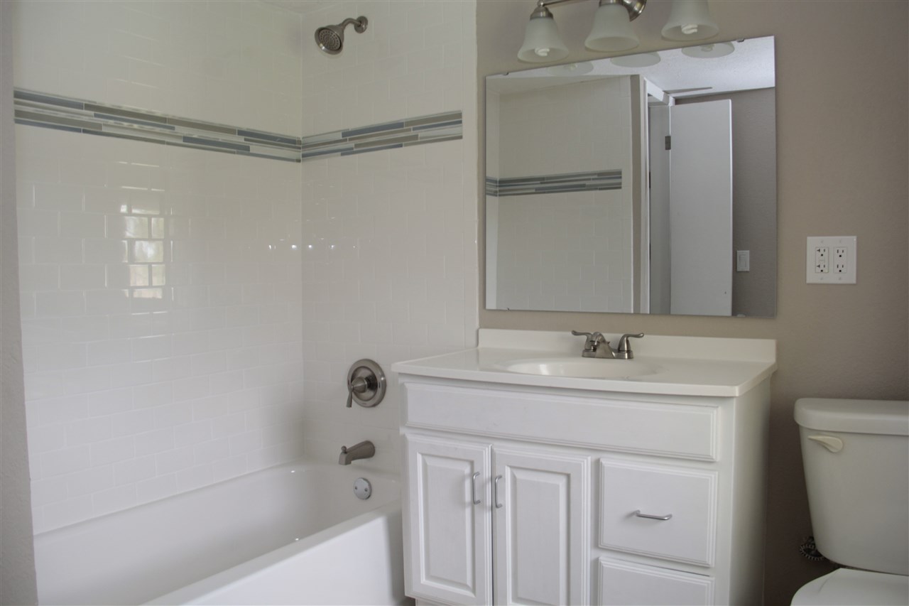 3618 Rotary Road Rockford, IL 61109 - Photo 14 of 24 a bathroom with a granite countertop sink toilet and shower
