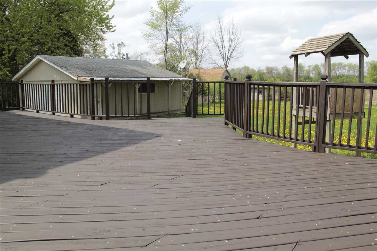 3618 Rotary Road Rockford, IL 61109 - Photo 18 of 24 a view of a house with a wooden deck