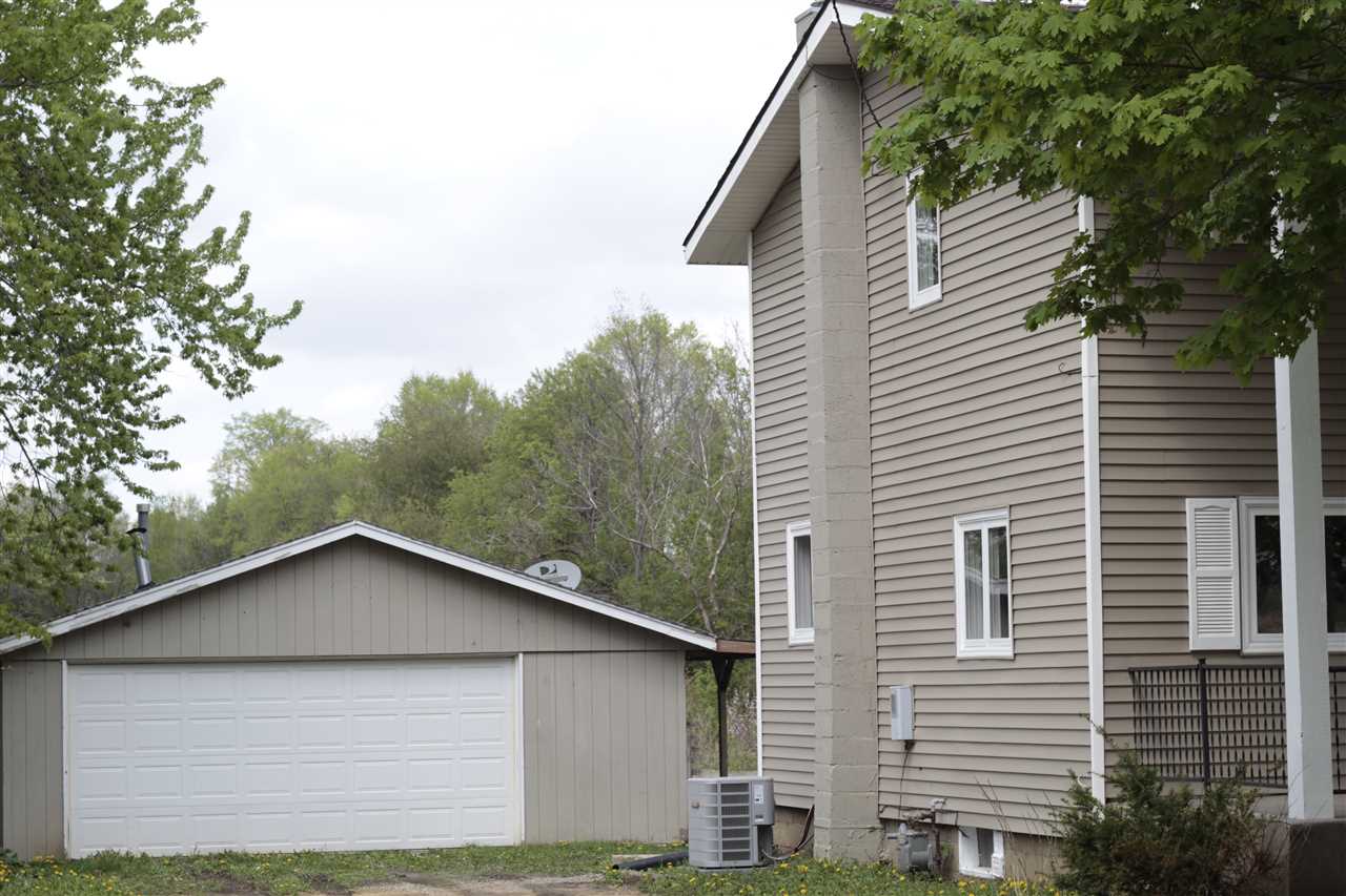 3618 Rotary Road Rockford, IL 61109 - Photo 2 of 24 a view of a house with a yard and garage