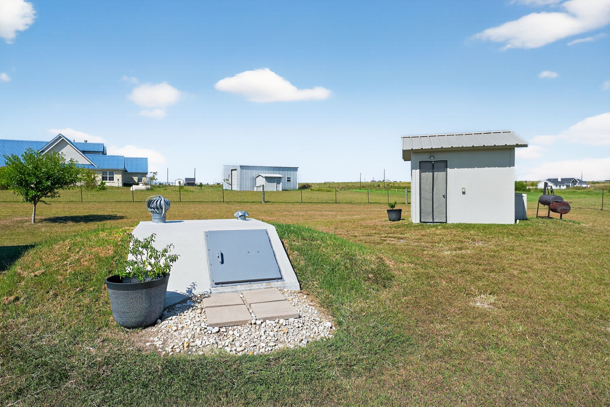 813 Cr 342 Road Granger, TX 76530 - Photo 28 of 32 Storm shelter, and the well house