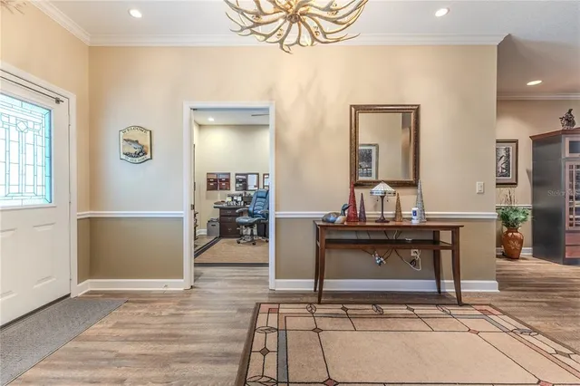 a kitchen with stainless steel appliances kitchen island granite countertop a refrigerator and a stove top oven