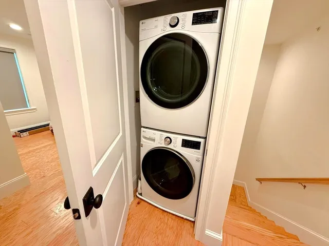 a view of a hallway with washer and dryer