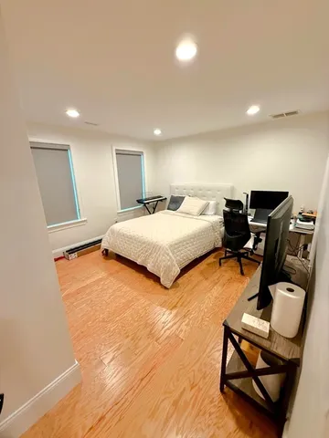 a bedroom with bed and window