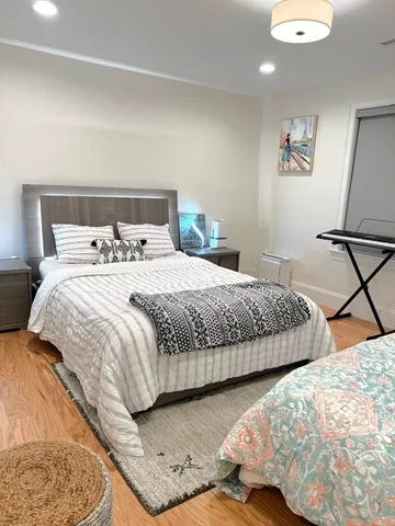 a bedroom with a bed and lamp