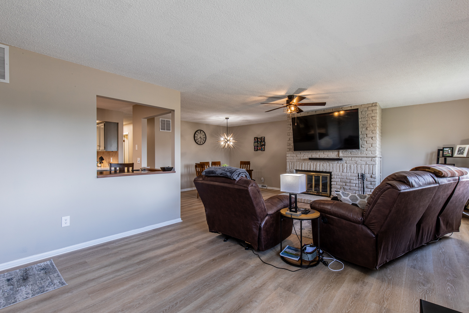 973 Innsbruck Lane, Unit 4G Princeton, IL 61356 - Photo 5 of 15 a living room with furniture and a flat screen tv