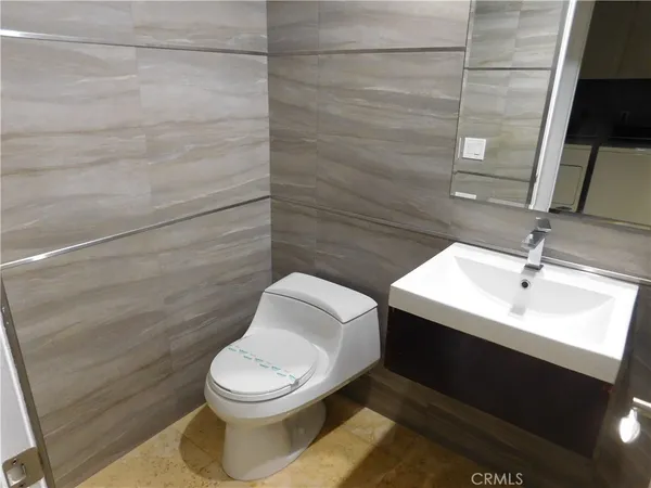 a view of a terrace with chairs and iron fence