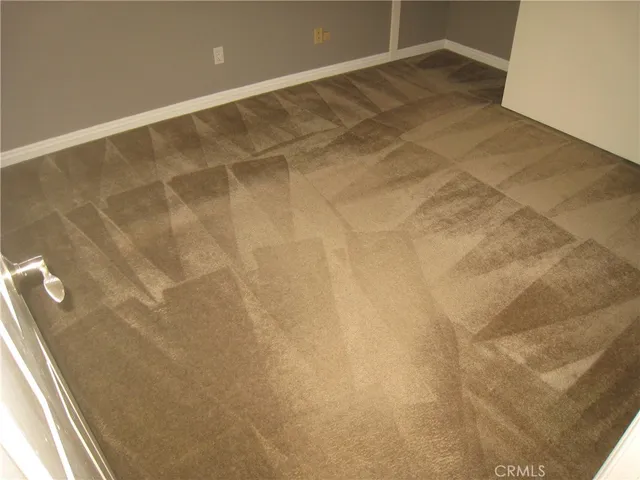 a close up of a utility room with dryer and washer