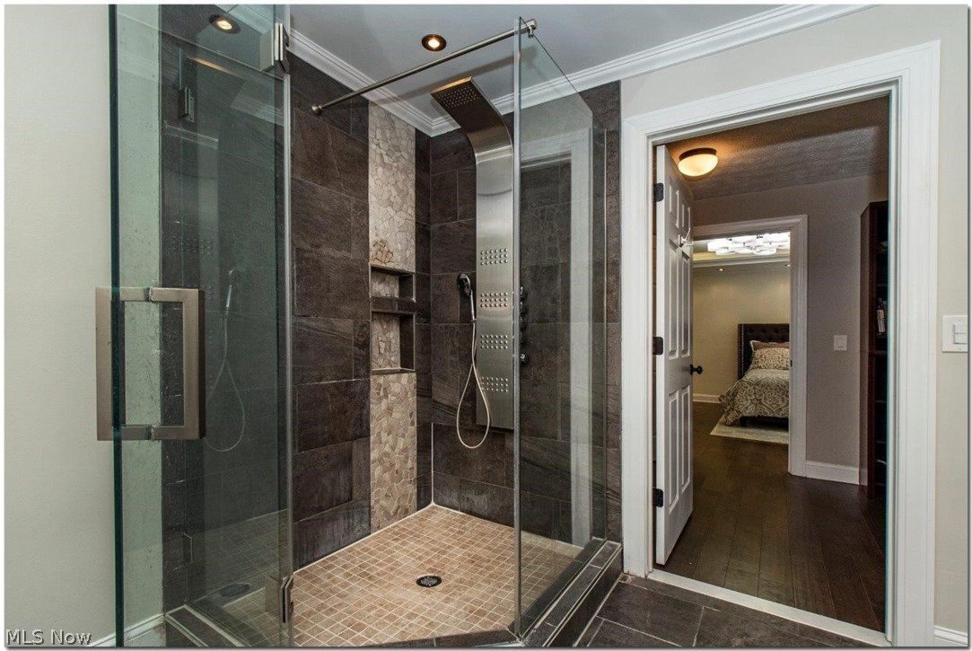 3200 Lander Road Pepper Pike, OH 44124 - Photo 23 of 35 French doors lead to the Owner’s Suite with walk-in closet and the lavish master bath features dual vanities, a soaking tub, and spacious glass shower