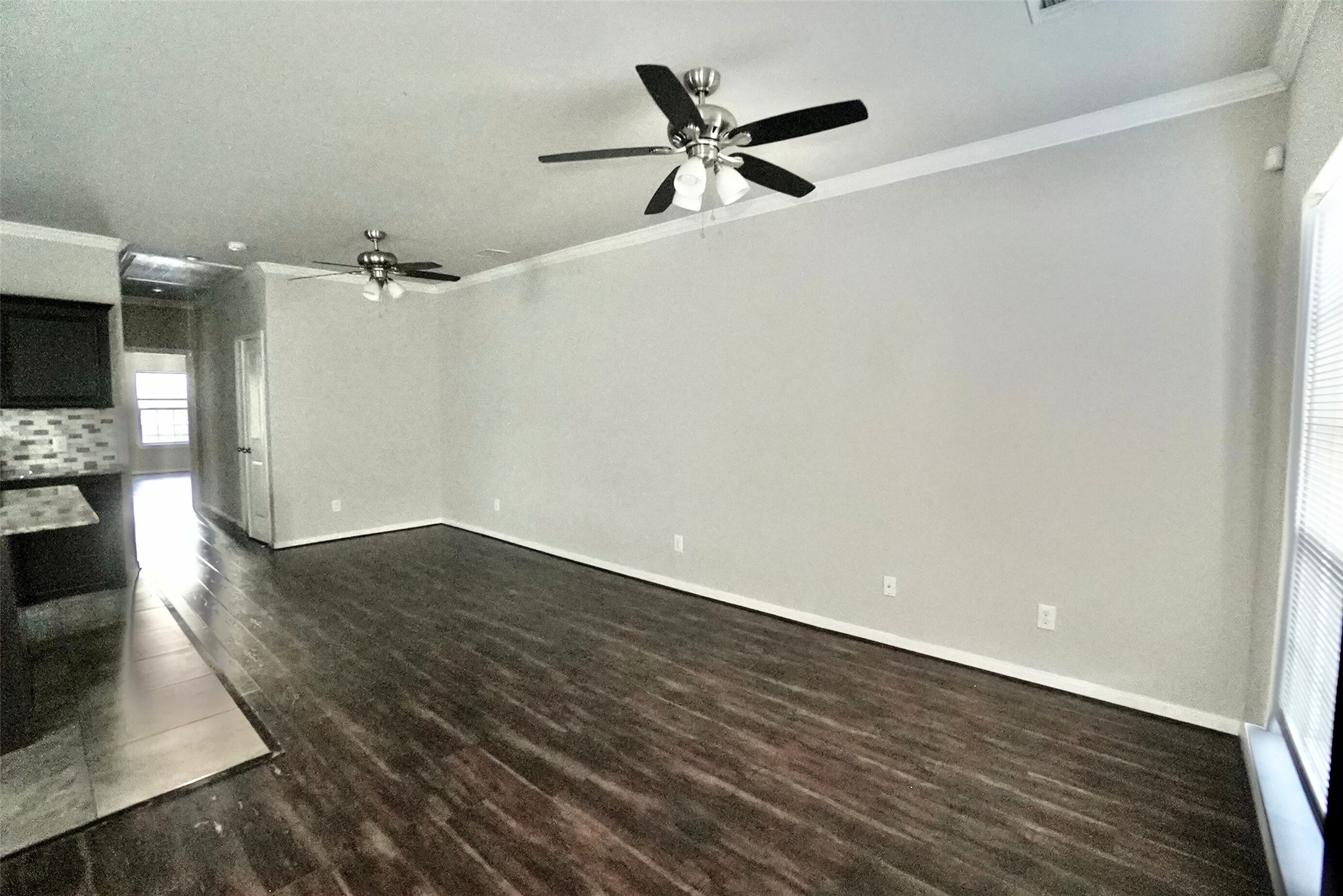 2523 Kirk Street, Unit B Houston, TX 77026 - Photo 7 of 16 a view of a livingroom with wooden floor and a fireplace