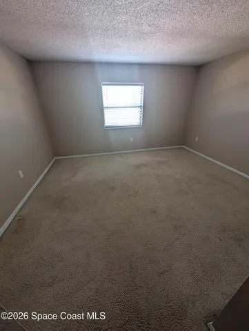 a bathroom with a toilet and a bath tub