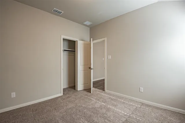 a backyard of a house with wooden fence