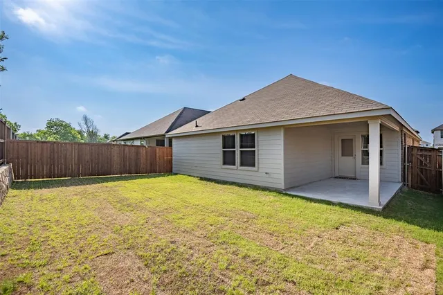 a view of a backyard of the house