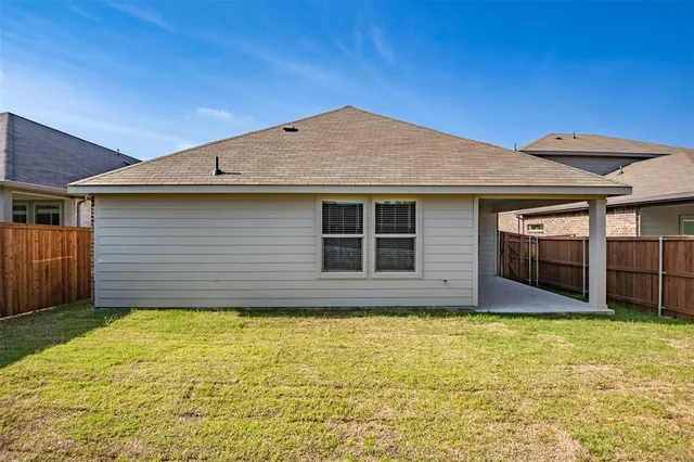 a view of a backyard with a cabin