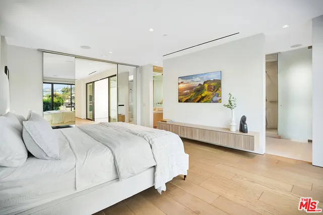 a bedroom with bed and window