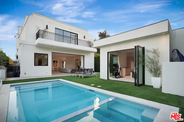 a view of a house with sitting area and furniture