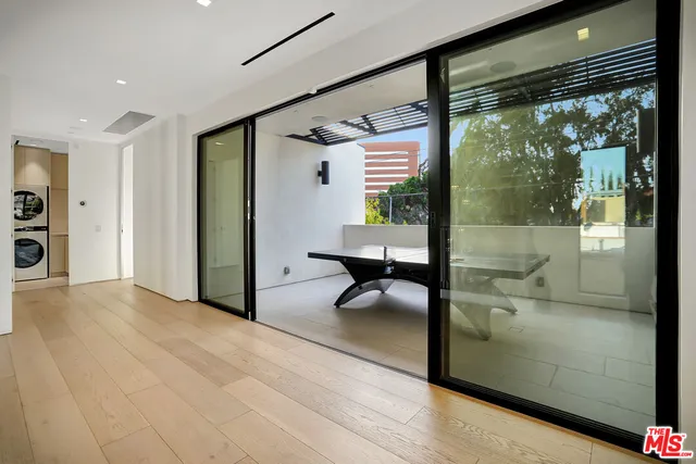 a room with furniture and a large window