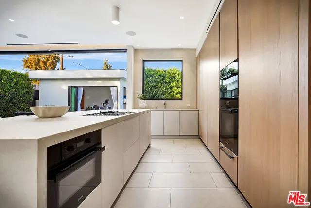 a kitchen with a sink and a refrigerator