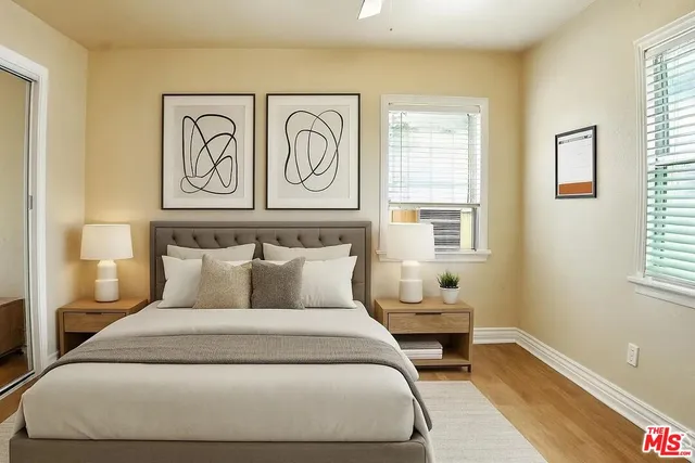 a bedroom with a bed and window