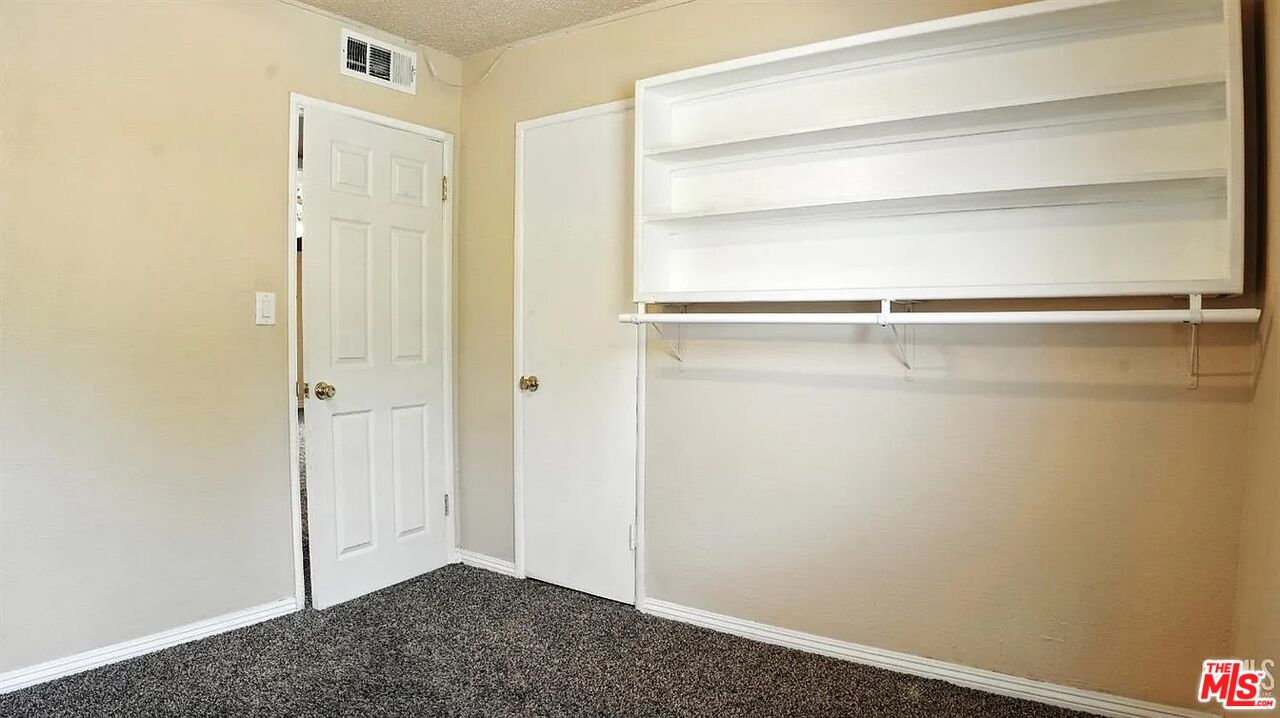 10931 Shellabarger Road Bakersfield, CA 93312 - Photo 23 of 44 a view of an empty walk in closet