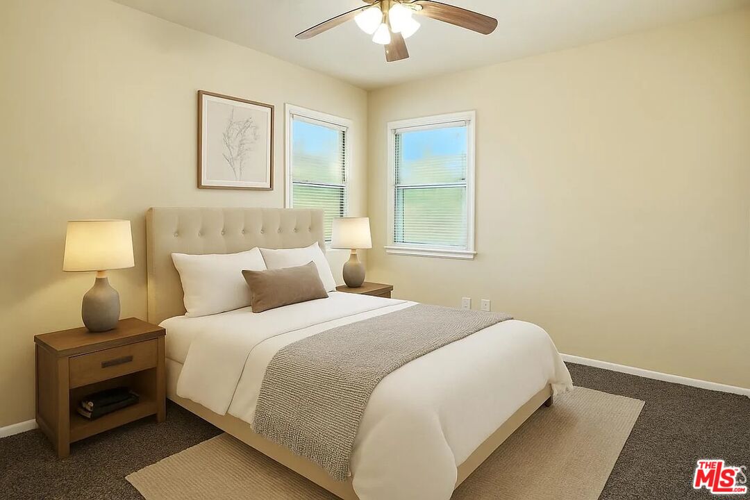 10931 Shellabarger Road Bakersfield, CA 93312 - Photo 27 of 44 a bedroom with a bed and a lamp