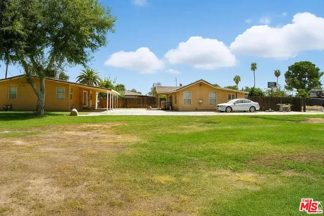 a view of a house with a snow in the yard