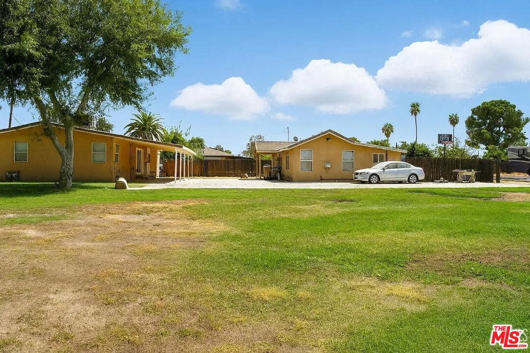10931 Shellabarger Road Bakersfield, CA 93312 - Photo 29 of 44 a view of a house with a yard and a fountain