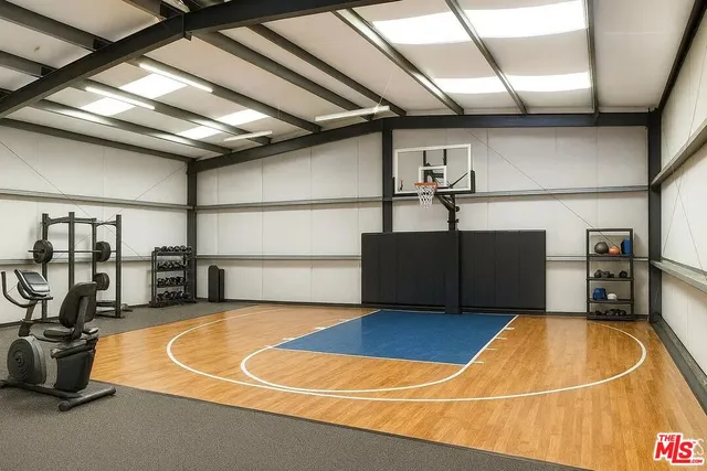 a view of swimming pool with palm trees