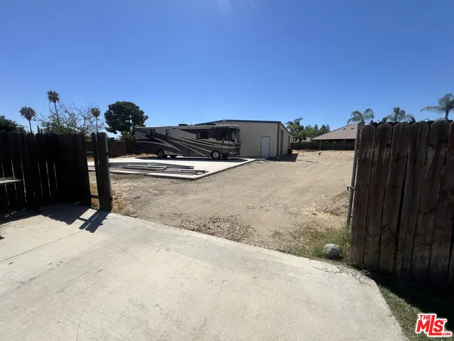 a view of a swimming pool with a yard