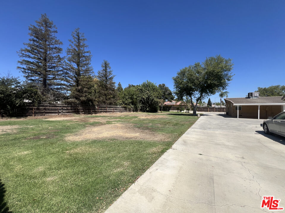 10931 Shellabarger Road Bakersfield, CA 93312 - Photo 43 of 44 a view of backyard of house with green space