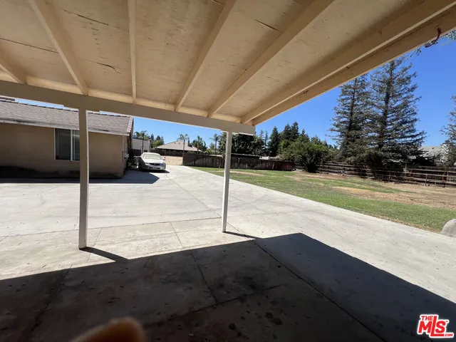 a view of a terrace with wooden floor and city view