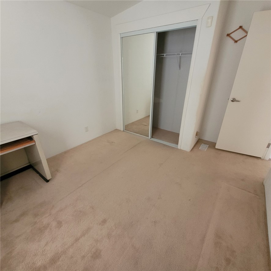 9732 2nd Street Chloride, AZ 86431 - Photo 28 of 28 The room features a mirrored closet and light-colored carpeting