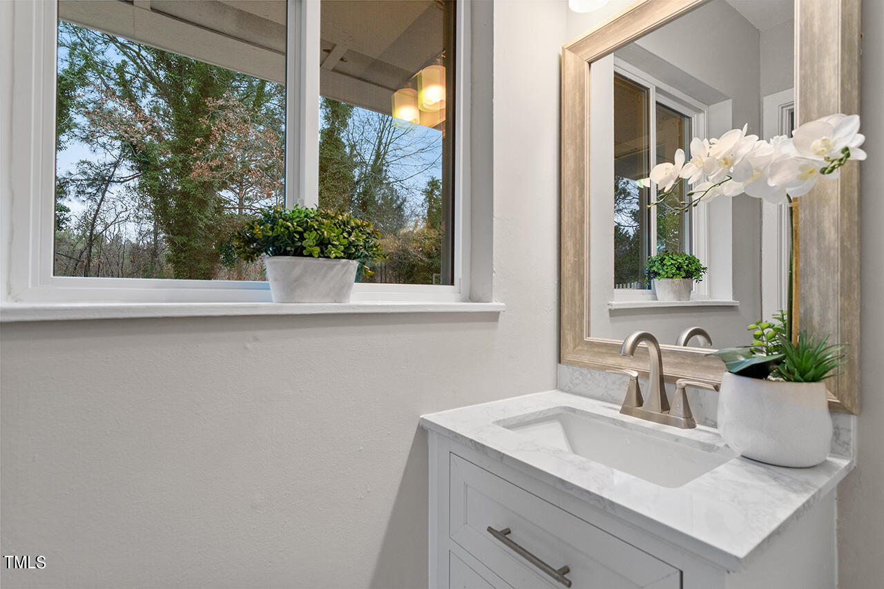 1610 Crescent Drive Spring Lake, NC 28390 - Photo 14 of 21 a bathroom with a sink and a mirror