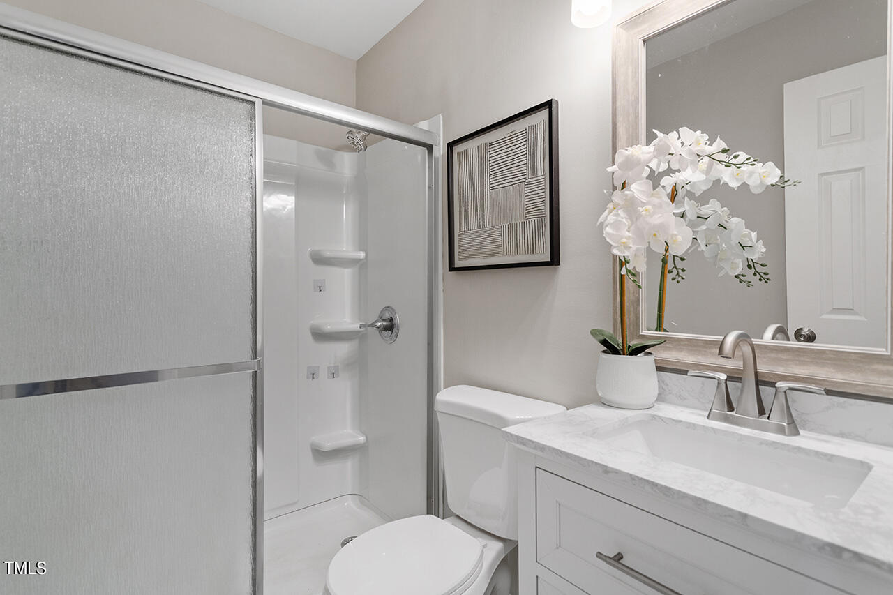 1610 Crescent Drive Spring Lake, NC 28390 - Photo 17 of 21 a bathroom with a sink toilet and shower